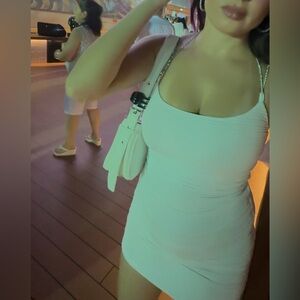 White ruched mini dress with adjustable straps!